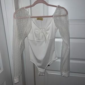Small white mesh sleeved bodysuit